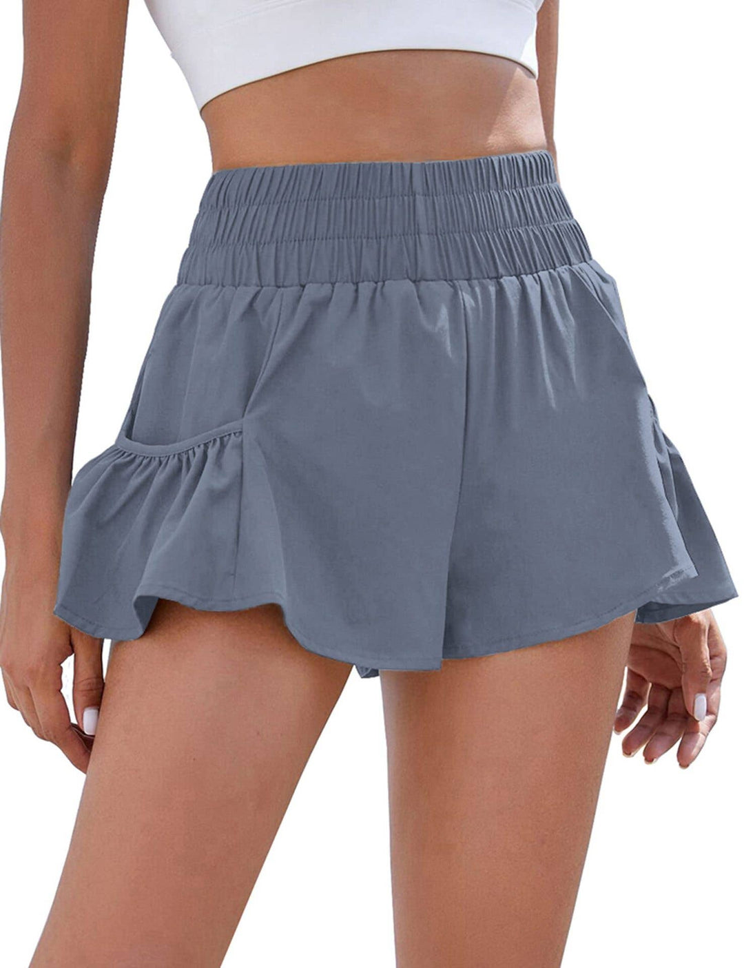 Flowy style high-rise workout shorts with pleated details
