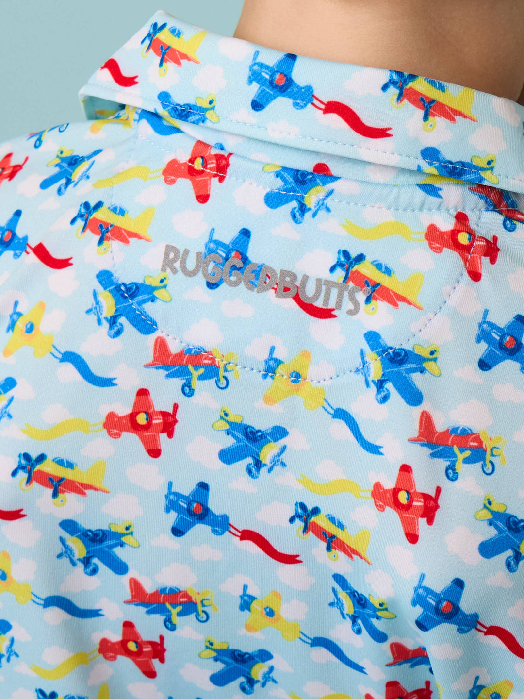 RuffleButts  Boys Tiny Plane Parade Knit Short Sleeve Performance Polo