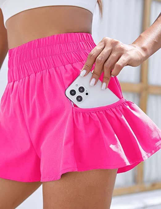 Flowy style high-rise workout shorts with pleated details