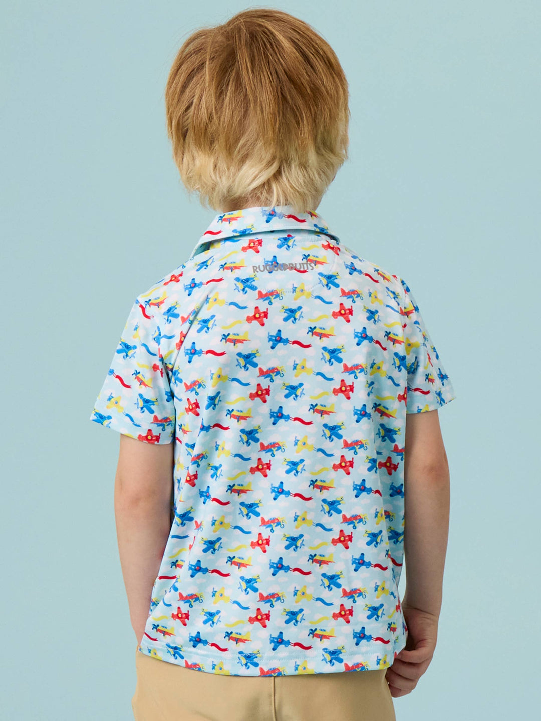 RuffleButts  Boys Tiny Plane Parade Knit Short Sleeve Performance Polo