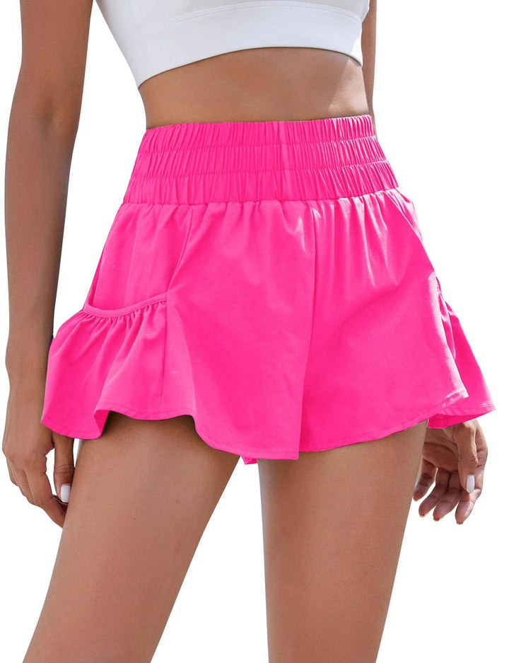 Flowy style high-rise workout shorts with pleated details