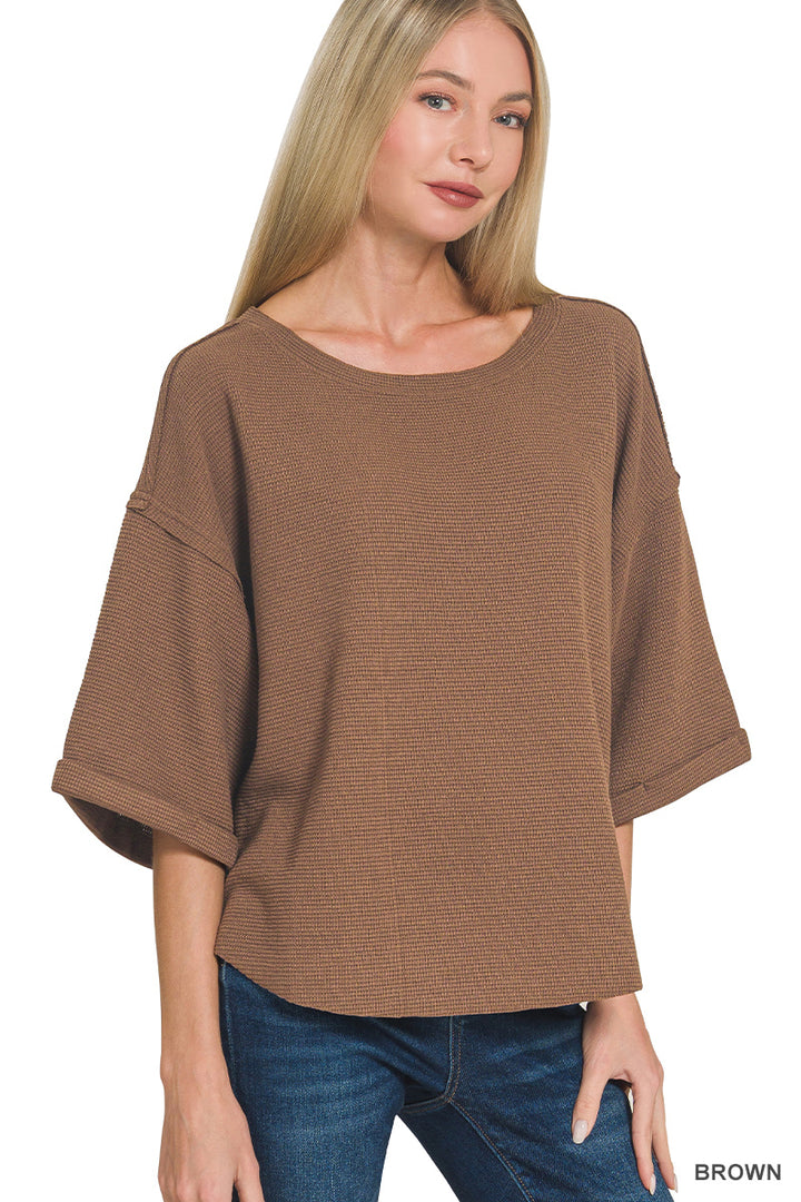 Double knit exposed seam curved hem short sleeve top