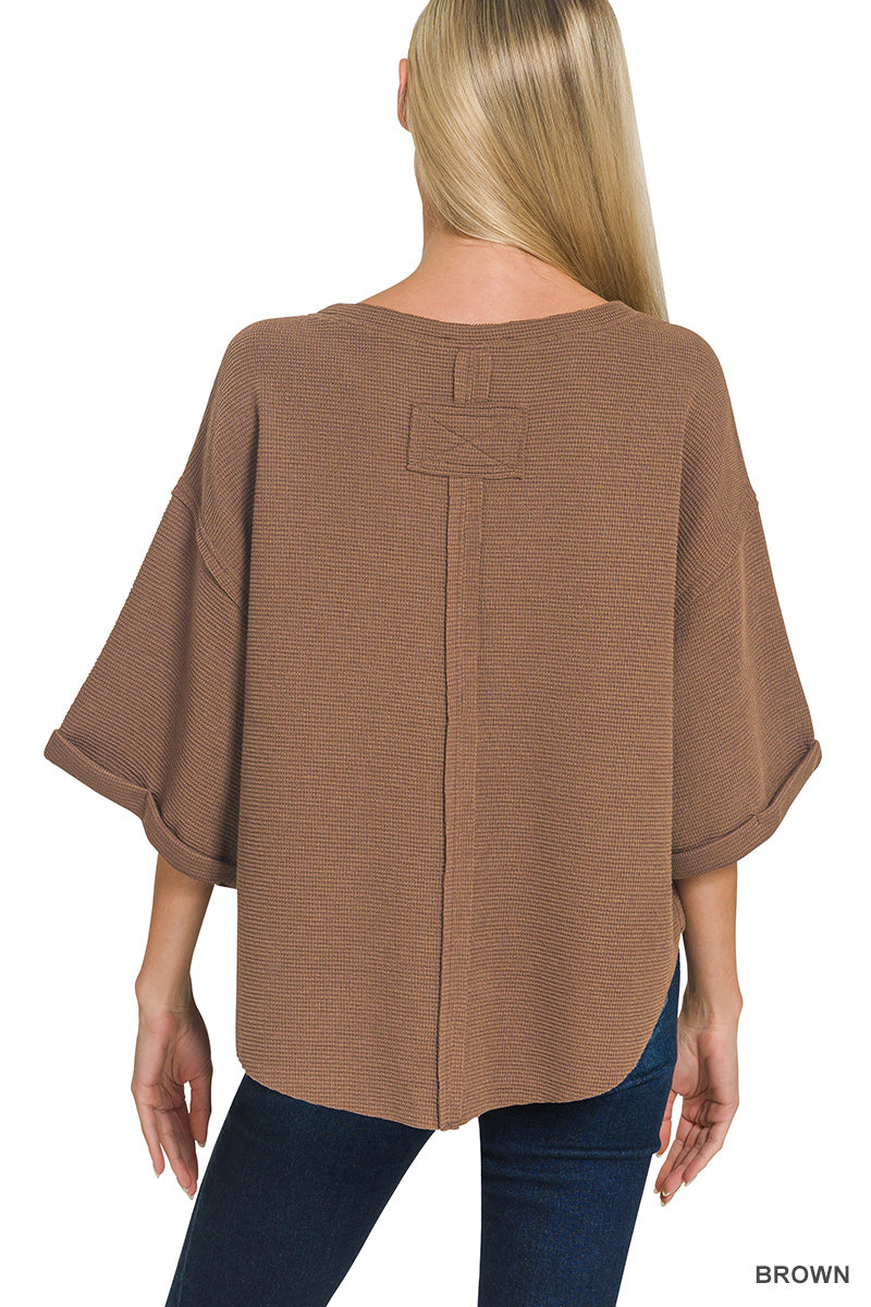 Double knit exposed seam curved hem short sleeve top