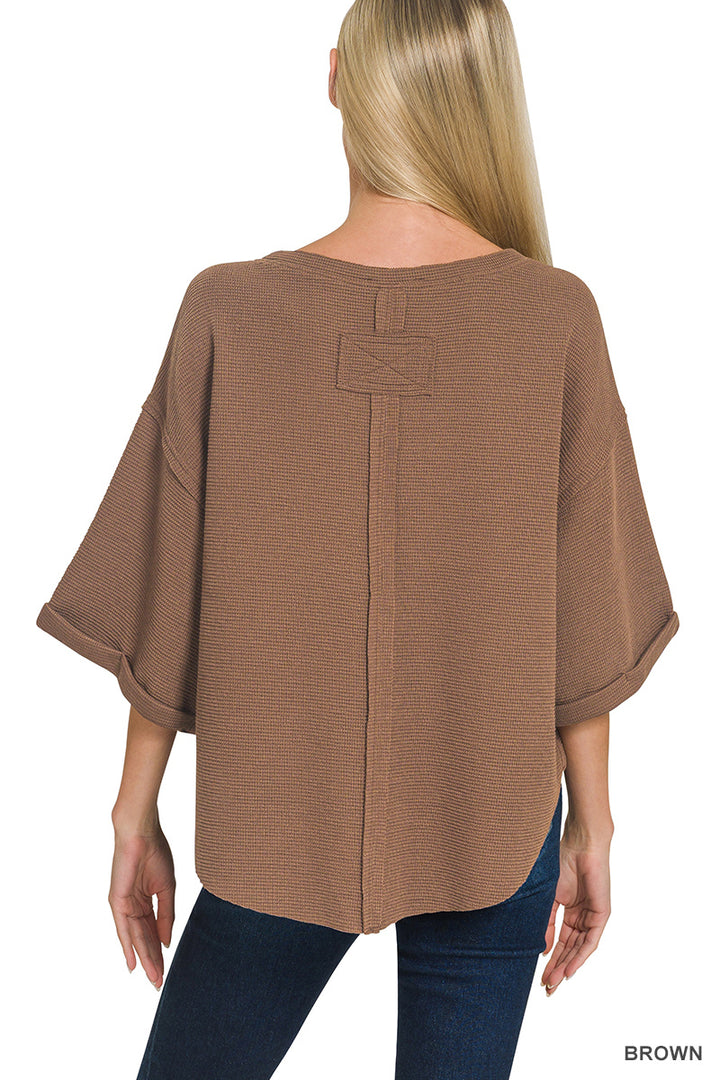 Double knit exposed seam curved hem short sleeve top