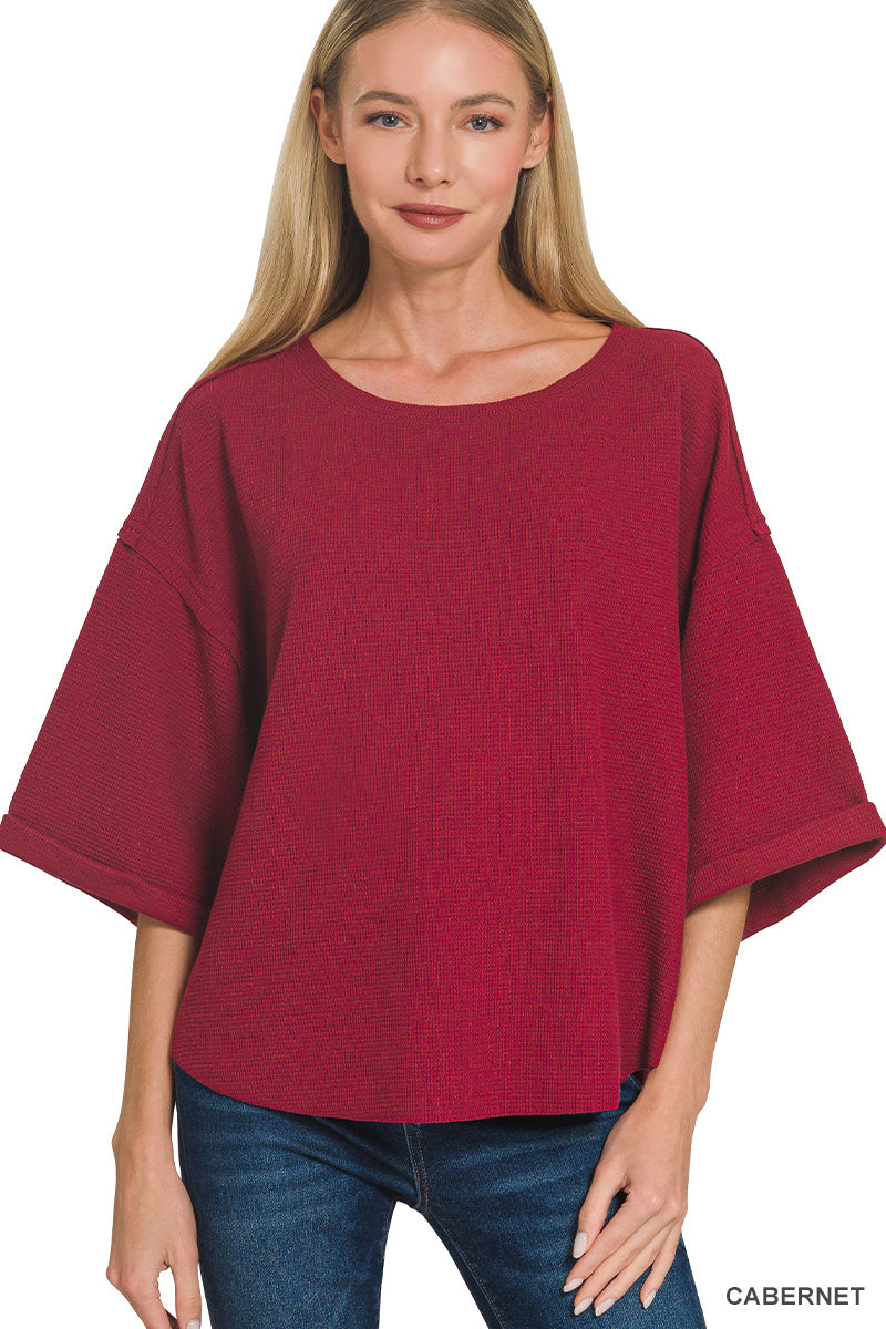 Double knit exposed seam curved hem short sleeve top
