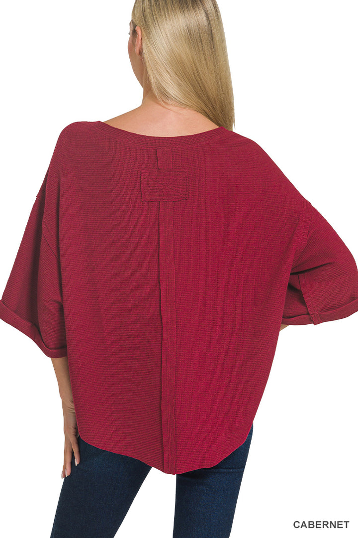 Double knit exposed seam curved hem short sleeve top