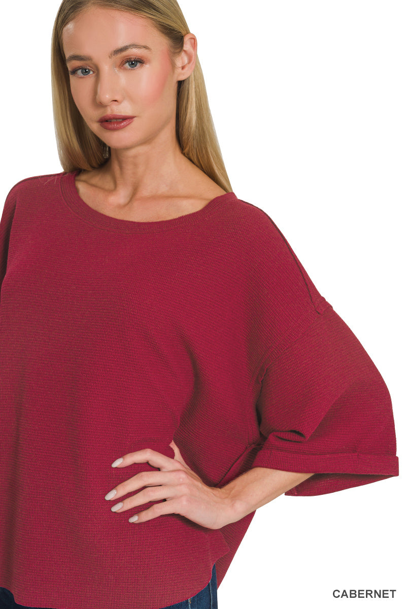 Double knit exposed seam curved hem short sleeve top