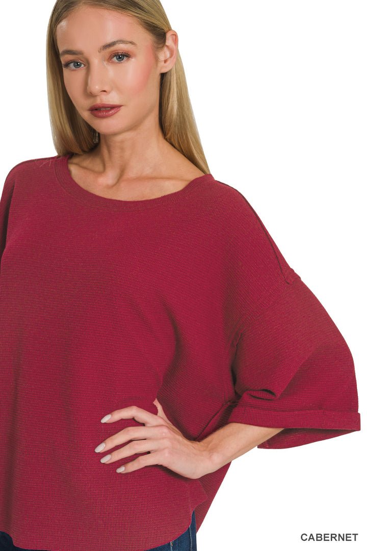 Double knit exposed seam curved hem short sleeve top
