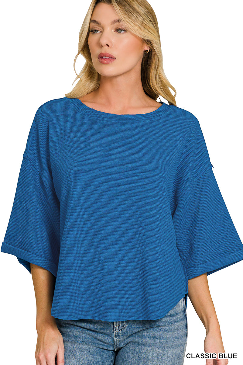 Double knit exposed seam curved hem short sleeve top