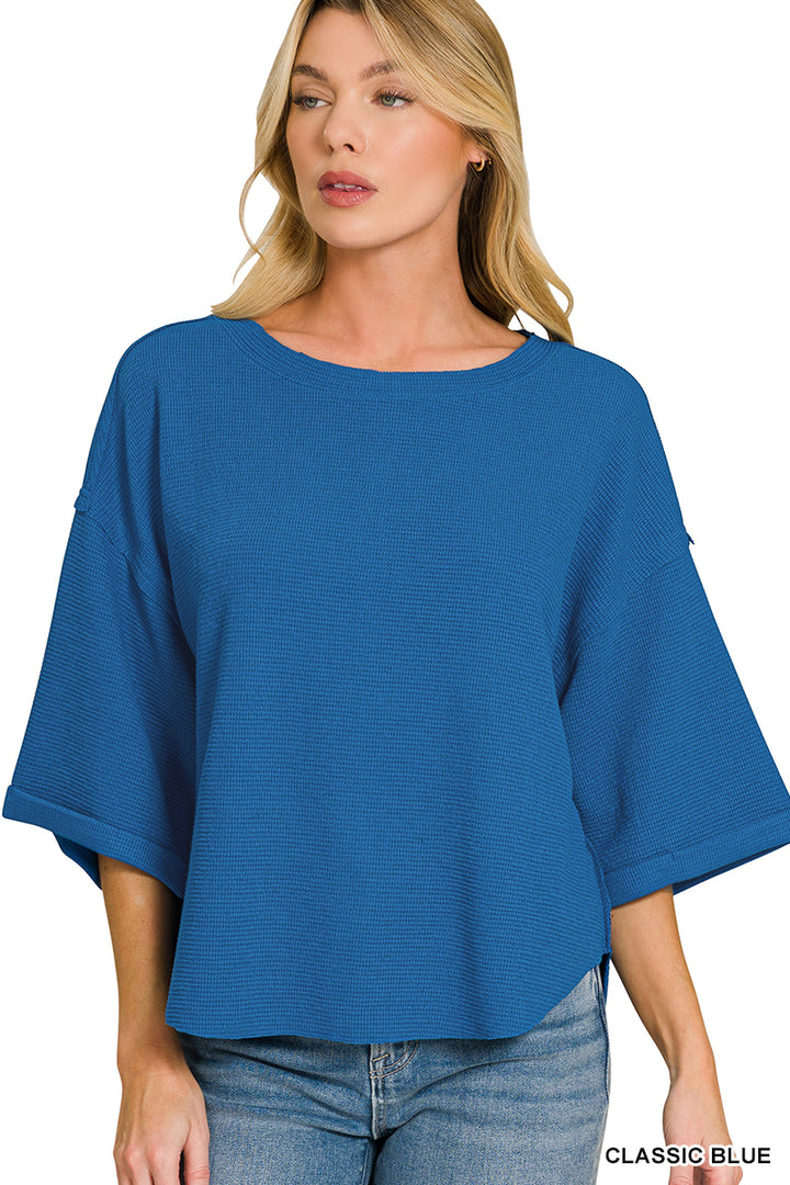 Double knit exposed seam curved hem short sleeve top
