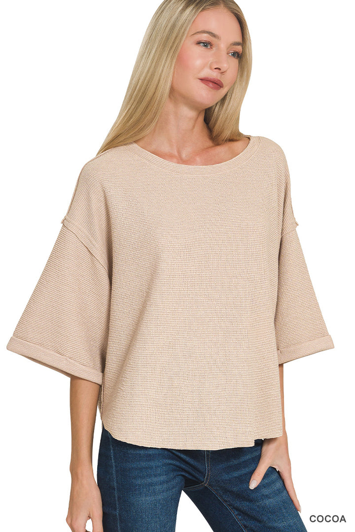 Double knit exposed seam curved hem short sleeve top