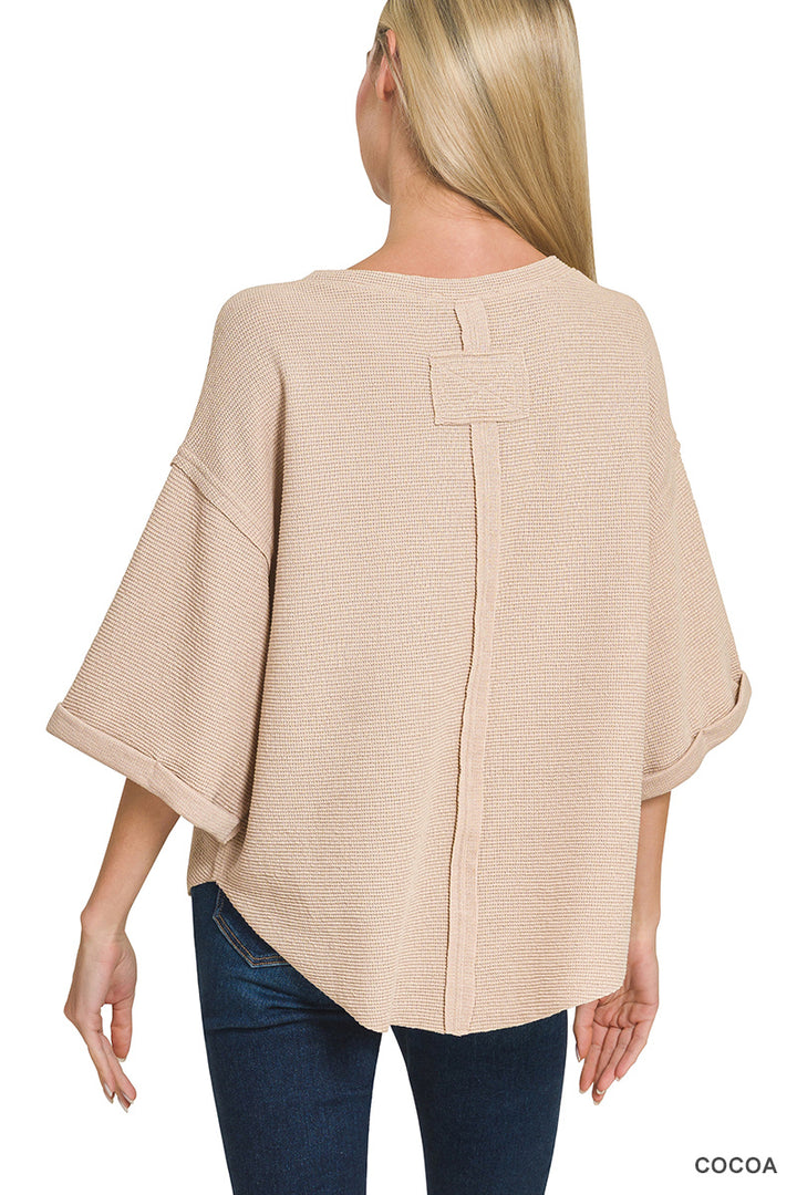 Double knit exposed seam curved hem short sleeve top