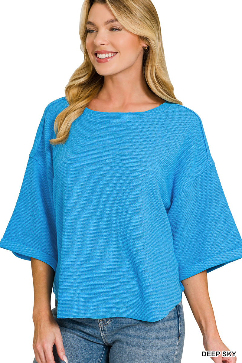 Double knit exposed seam curved hem short sleeve top