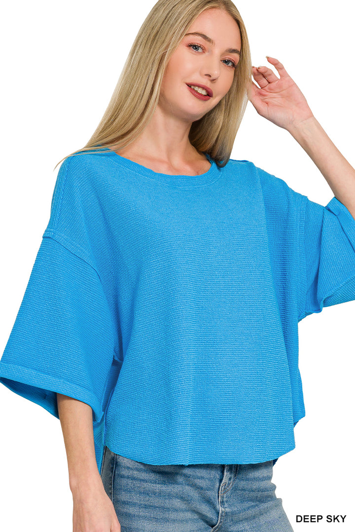 Double knit exposed seam curved hem short sleeve top