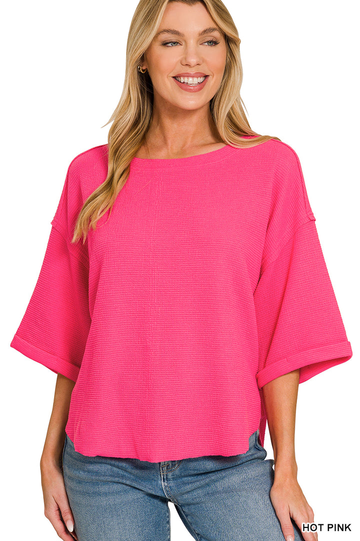 Double knit exposed seam curved hem short sleeve top
