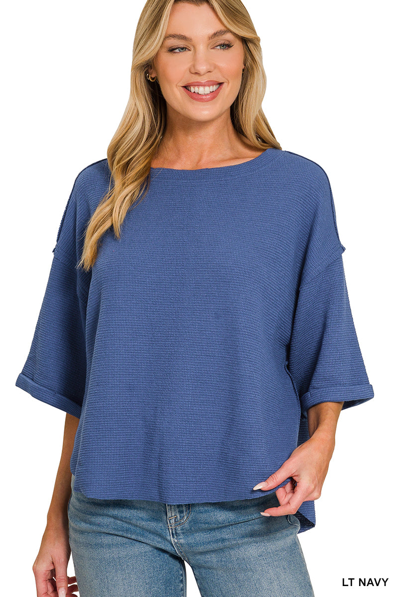 Double knit exposed seam curved hem short sleeve top