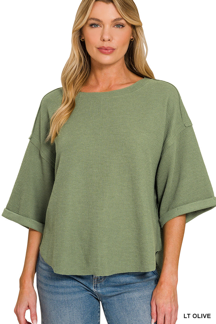 Double knit exposed seam curved hem short sleeve top