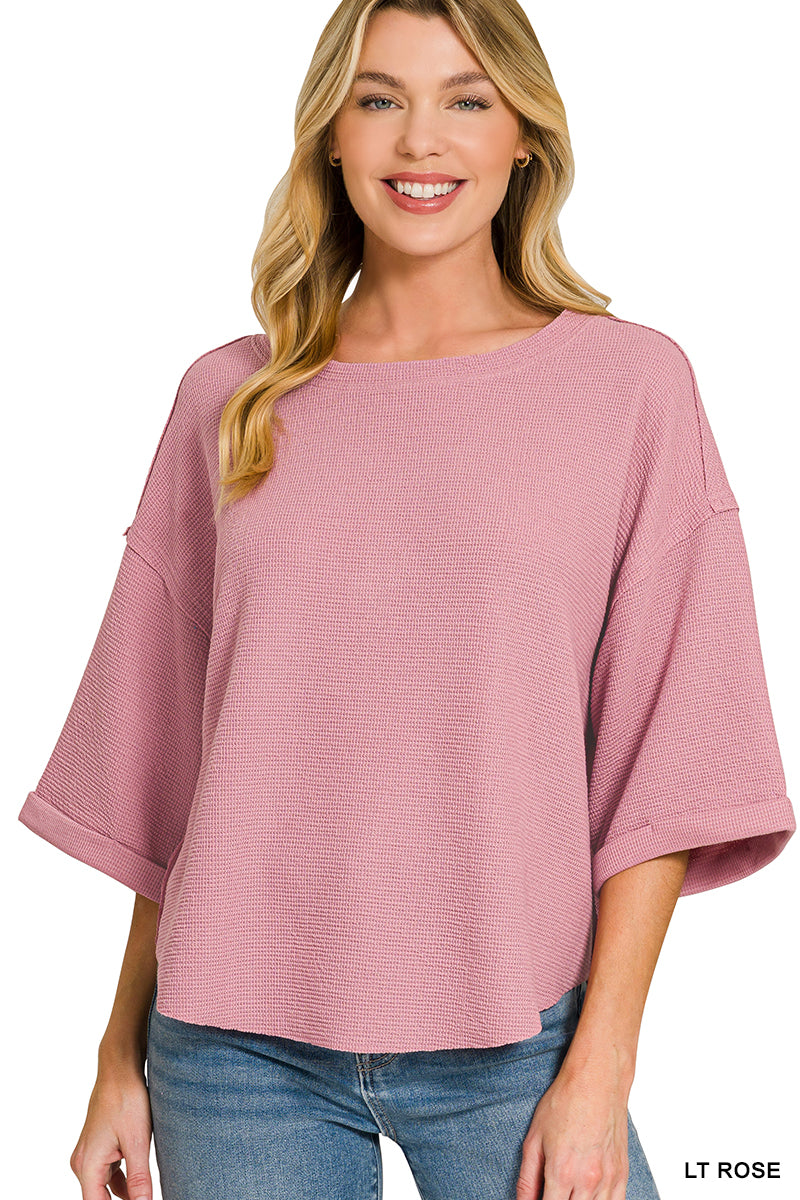 Double knit exposed seam curved hem short sleeve top