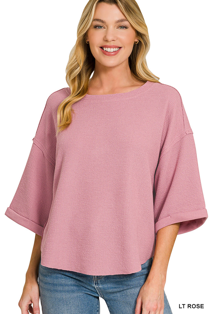 Double knit exposed seam curved hem short sleeve top