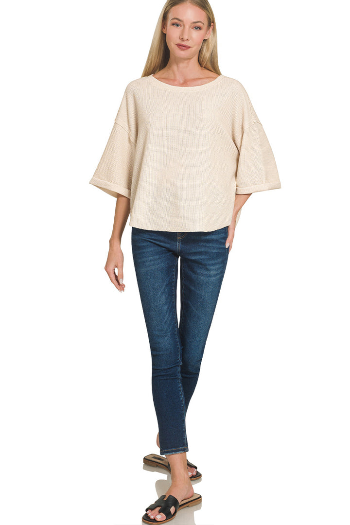 Double knit exposed seam curved hem short sleeve top