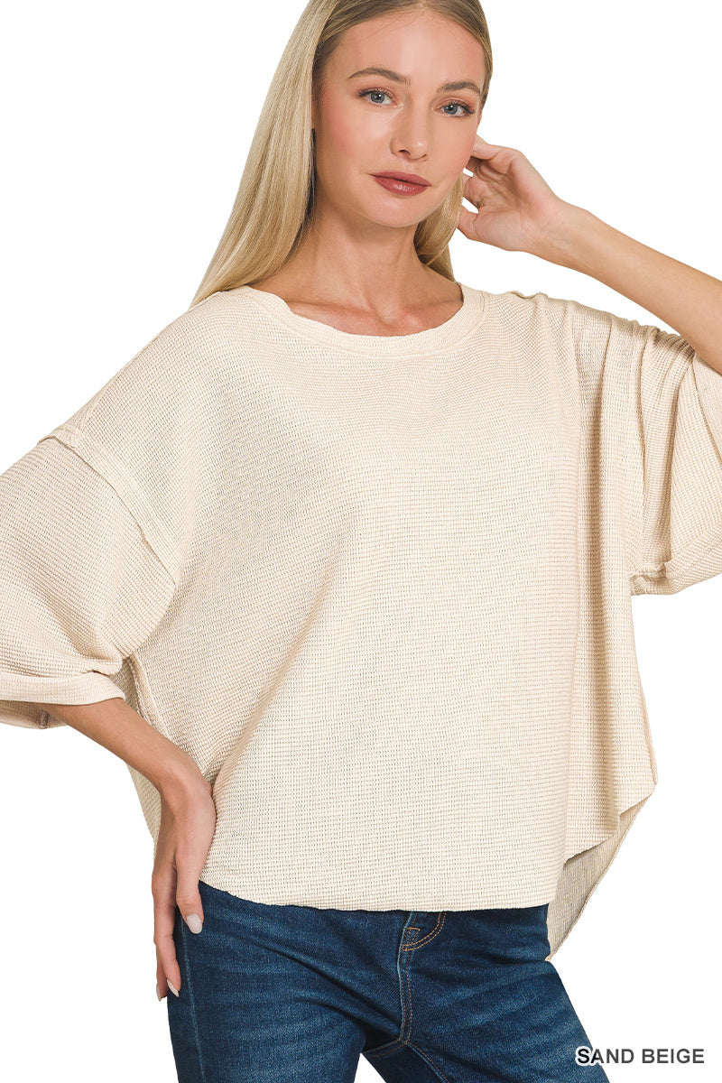 Double knit exposed seam curved hem short sleeve top