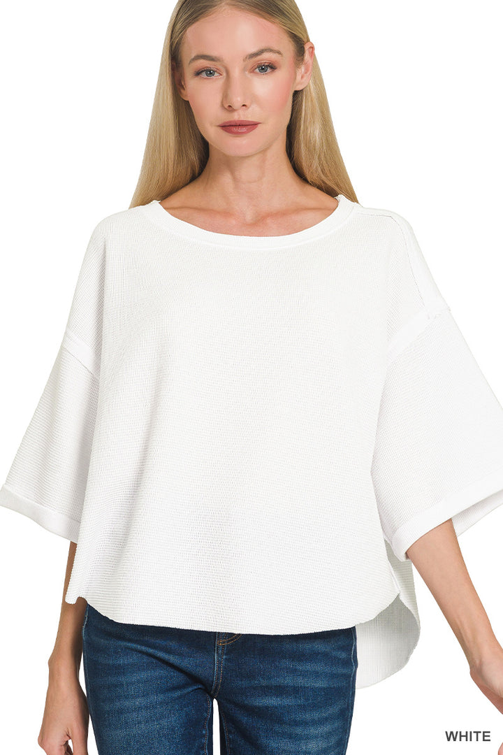 Double knit exposed seam curved hem short sleeve top