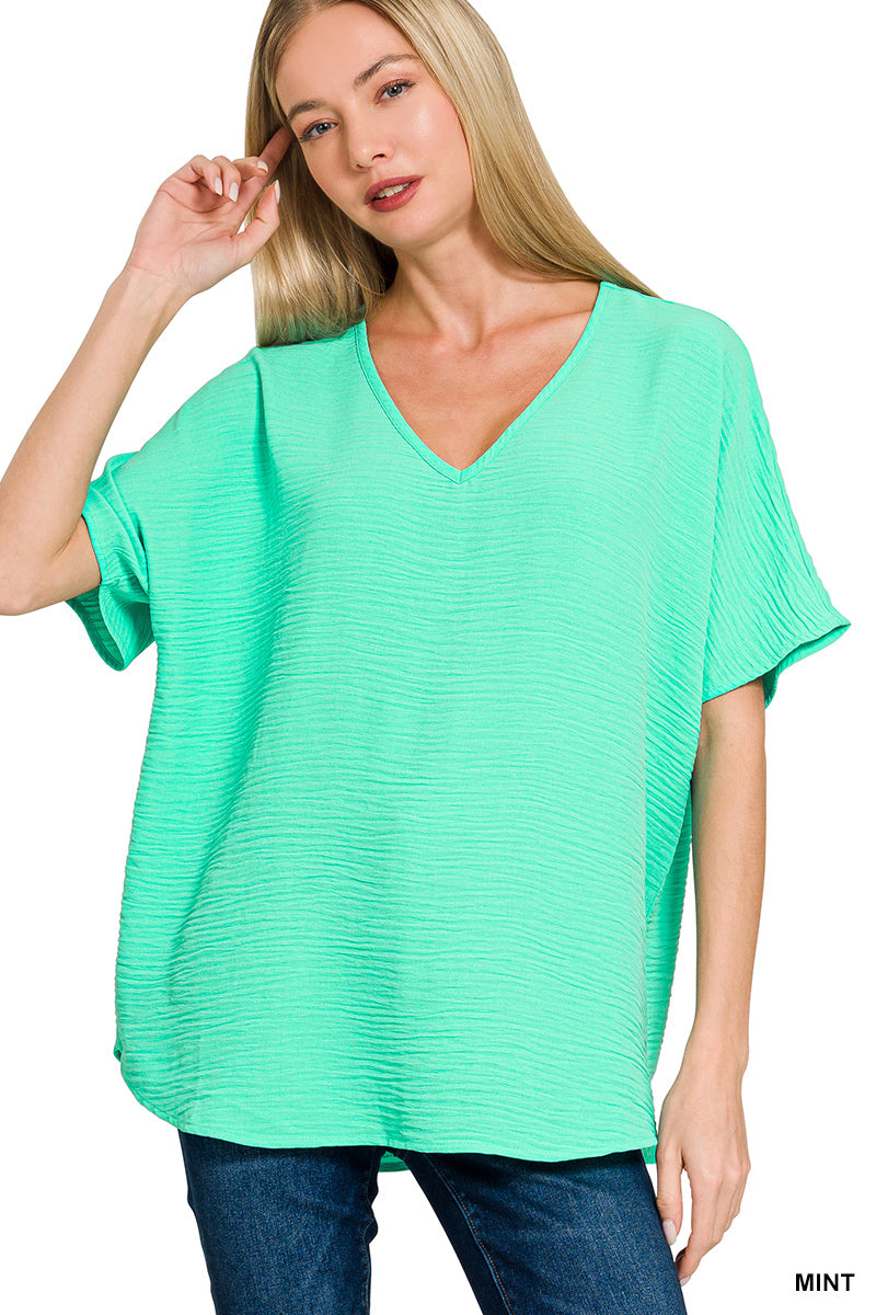 Woven airflow v-neck short sleeve top