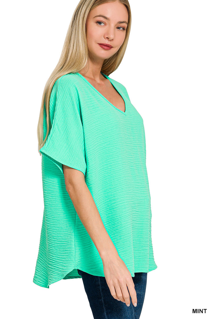 Woven airflow v-neck short sleeve top