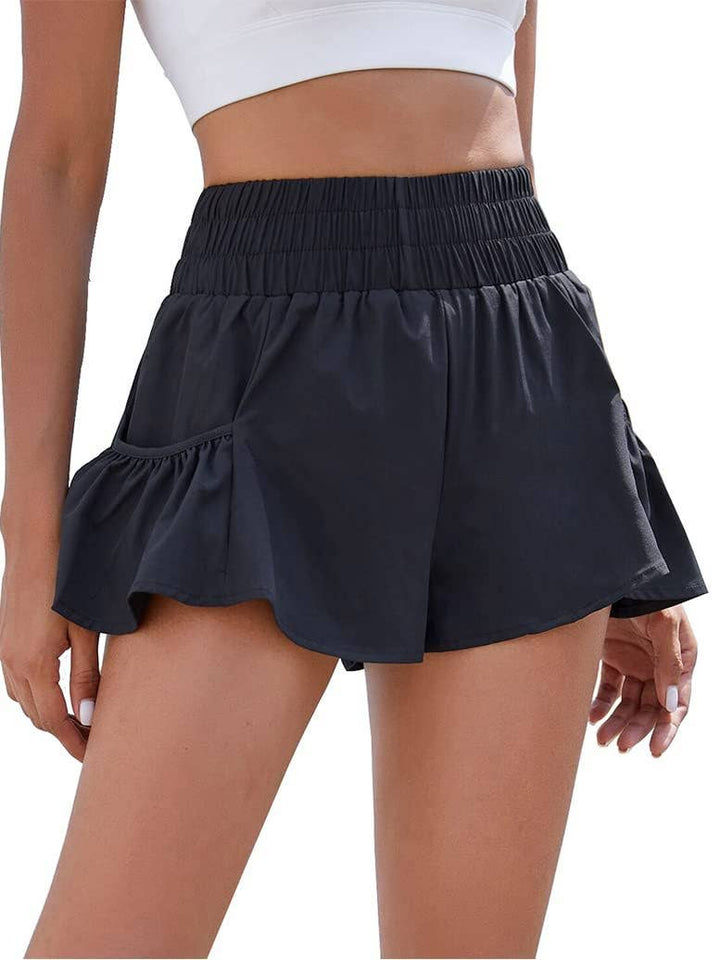 Flowy style high-rise workout shorts with pleated details