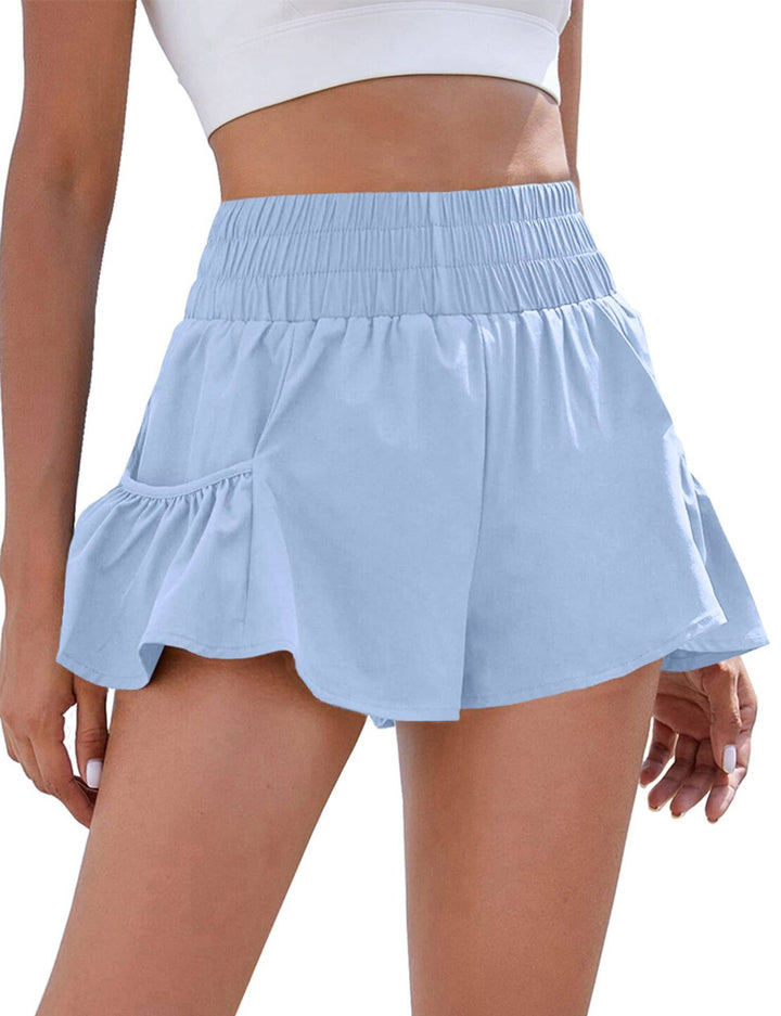 Flowy style high-rise workout shorts with pleated details